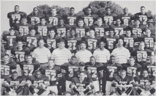 Varsity team (1992). Bottom (L to R): Philip Ortiz, Tyrale Evans, Jeff Jimenez, Sam Quinones Jr., Bret Lawrie, Reuben Mendez. 2nd Row: Anthony Shipe, Antonio Reyes, Steve Burks, Kevin Womack, John Rice, Willie Grisby, Jeff Littlejohn, Marko Estrada. 3rd Row: Michael Gargalikis, Coach Joe Aliotti, Coach Sam Quinones, Coach Herc Pardi, Coach Lenny Davis, Coach Jerry Haflich, Ryan Lopez. 4th Row: Kris Leffle, Christian Cornejo, Eddie Fischer, Lu Hearns, Shannon Lowry, Cy Simonton, Scott Van Fossen, Marty Roberts. 5th Row: John McCoy, Charlie Ramirez, Brian Horace, Julio Coronado, Mike Durflinger, Curtis Axel, Jared Rubio. Top Row: Regan Upshaw, Jamar Snipes, Dan Jordan, Chris Boxley, Charles Wilson, Sam Belete, Detric Edwards, Mike Tafoya.