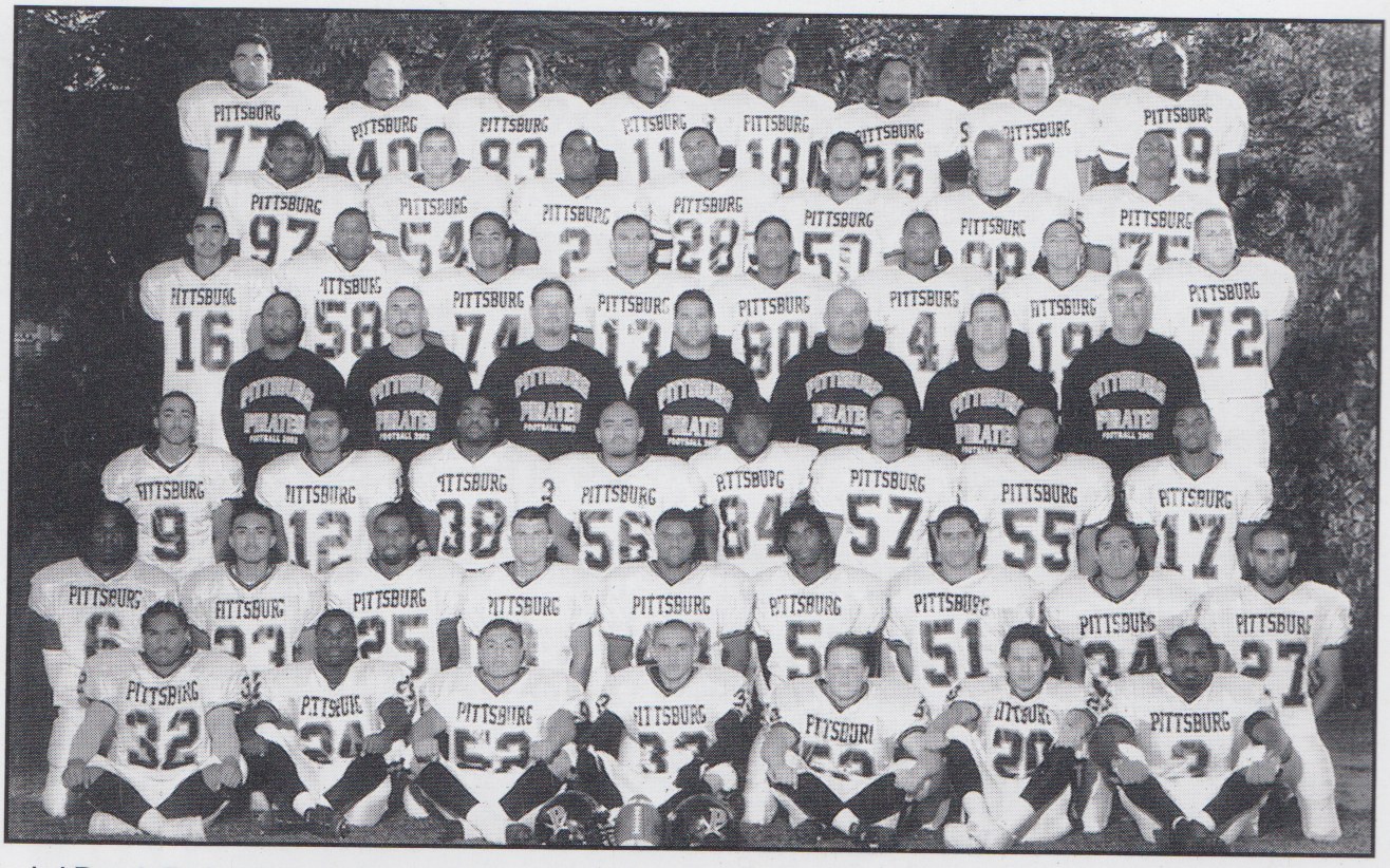 Varsity team (2003). Top Row: Daniel Paul, Robert Crawley, Perseus Robinson, Richard McNeal, Jason Crawley, Kenneth Broach, Vince Seeno, & Ra'Shon Harris. 2nd Row: Ron Schenck, Kyle Pifer, Brian Robinson, Antonio Blanche, Zack Hernandez, Chris Terry, & Lou Mills. 3rd Row: Ricardo Hurtado, Tyree Mollique, Willie Faafiti, Juan Corral, Robert Cox, Raphael Itson, Robert Dimery, & Matt Lemely. 4th Row: Coach Brinkley, Coach Bastianelli, Coach Shipe, Coach Galli, Coach Gay, Coach Orlando, & Coach Abono. 5th Row: Deric Davis, Josh Prasad, Benjamin Blackman, Abner Macanas, WIllie Brown, David McLain, Michael Lopez, & Joseph Blackman. 6th Row: Roderick Wyatt, Rodney Loquiao, Don Smith, David Clift, Tony Moffett, Foster Goree, Joey LaMacchia, Saka Faafiti, & Dave Bains. Last Row: Tino Felise, Jelani Killings, Osvaldo Rivera, Gabe Vega, Jason Johns, Ramon Rodriguez, & Derek Blanche.